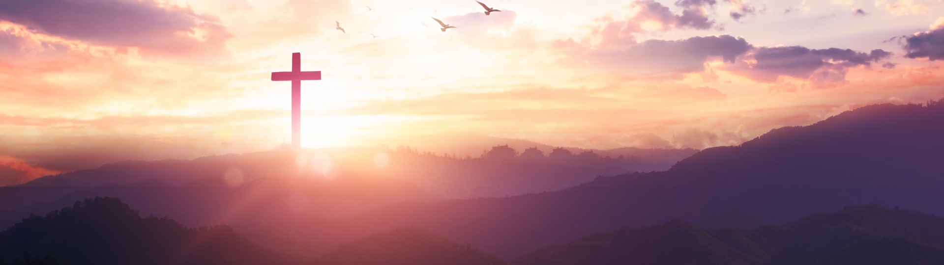 Sunrise behind a cross